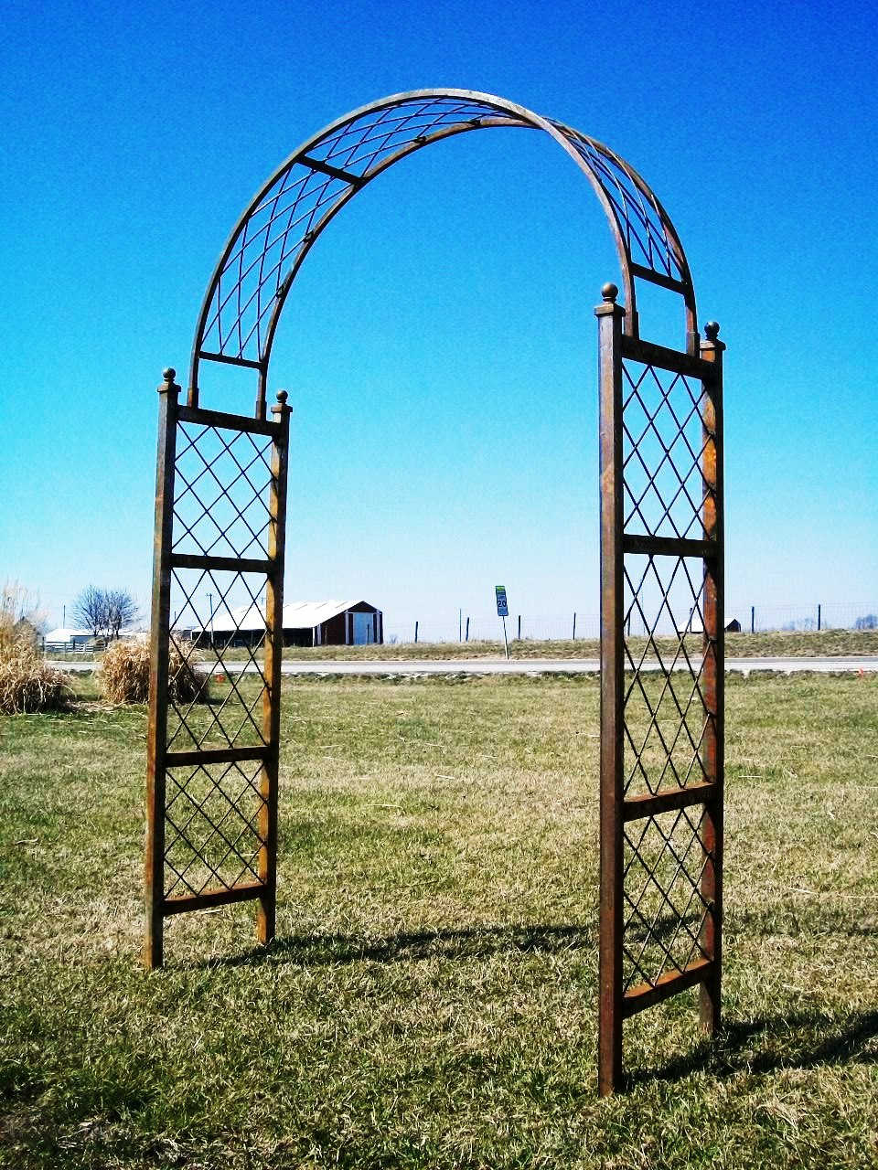 Wrought Iron Round Top Arbor in Natural Rust